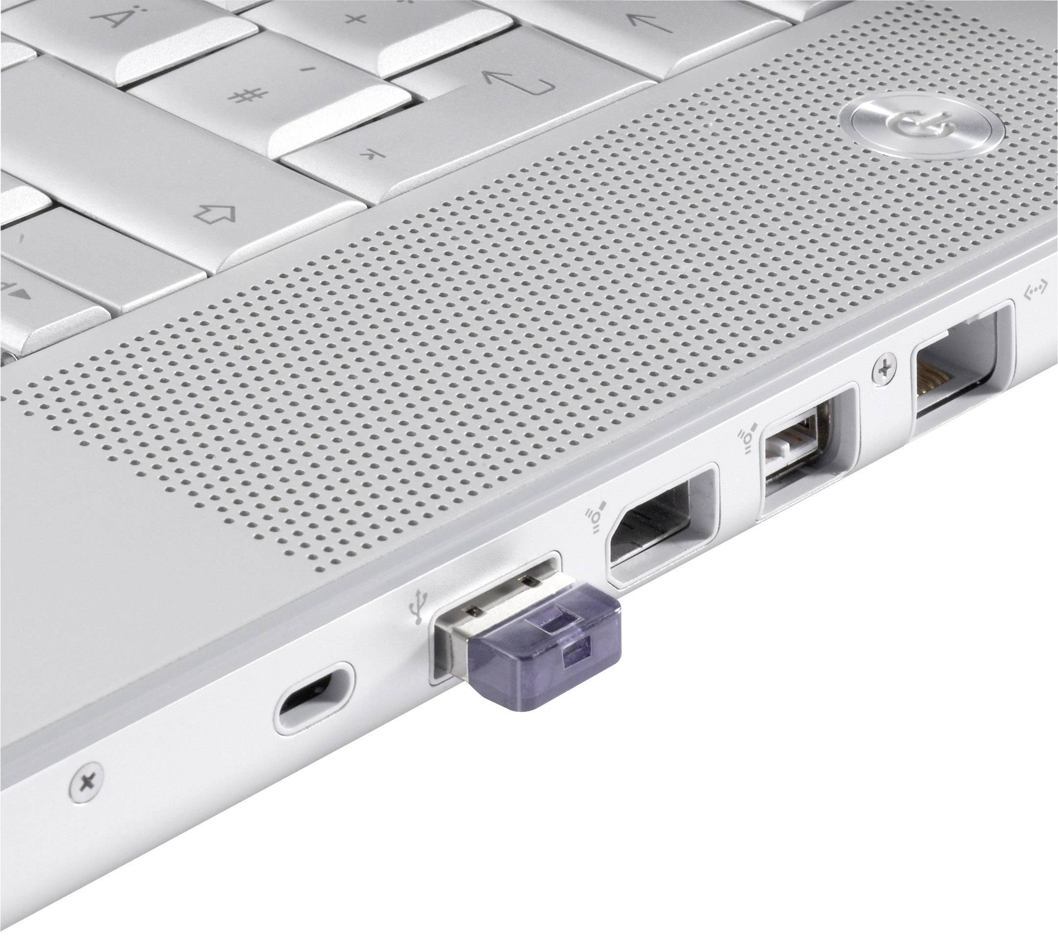 Nahaufnahme eines Laptops mit mehreren Anschlüssen an der Seite, darunter ein USB-Stick, ein Netzwerkport und Audioanschlüsse.