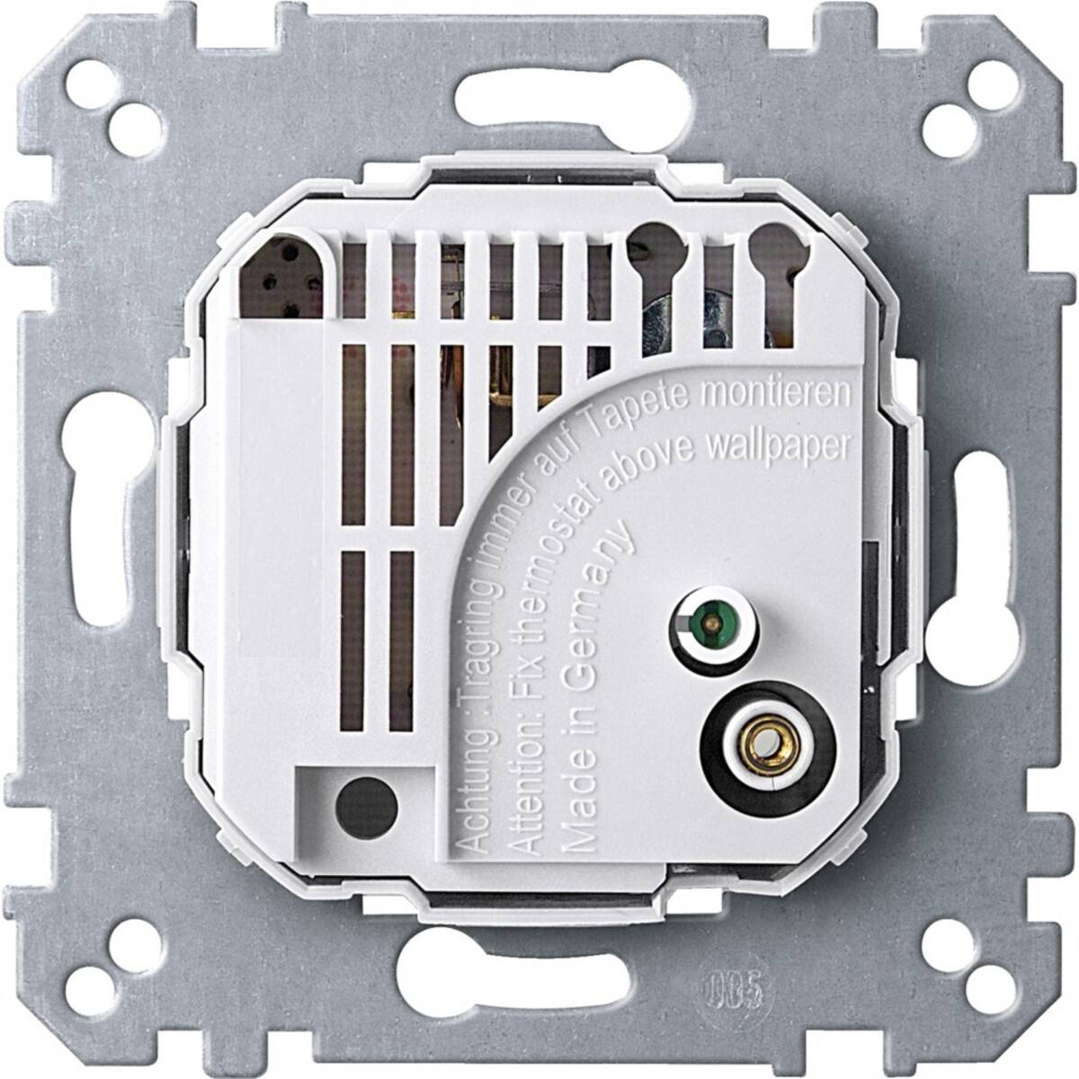 Wandmontiertes elektrisches Schalter- oder Thermostatmodul auf einer Metallmontageplatte mit Anschlüssen und geprägtem Installationswarntext.
