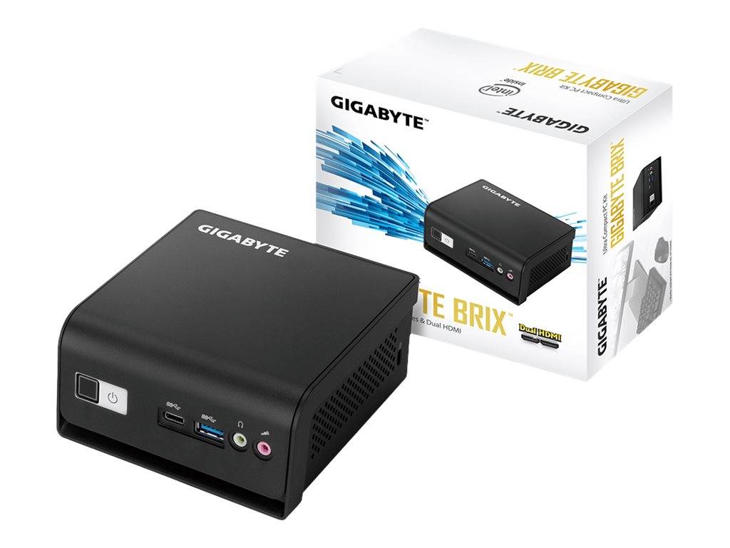 GIGABYTE BRIX Mini-PC neben seiner Einzelhandelverpackung gezeigt, mit Netzschalter an der Vorderseite, USB-Anschlüssen, Audiobuchsen und kompaktem schwarzem Design.