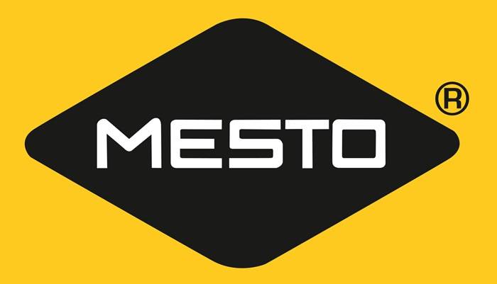 Ein schwarzes Rautenform auf gelbem Hintergrund mit dem Wort 'MESTO' in fetten, weißen Buchstaben, zentriert innerhalb der Form.