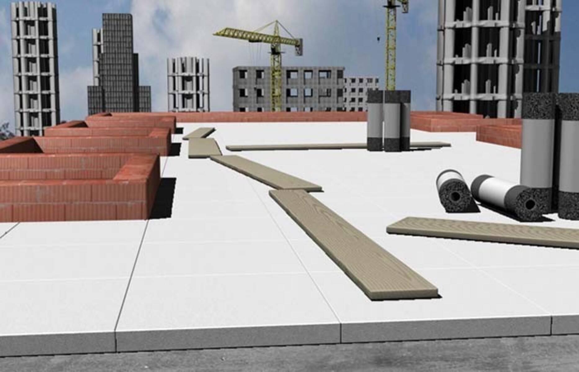 Baustelle mit Kränen, unvollendeten Gebäuden und Stapeln von Baumaterialien auf einem Betonboden unter einem bewölkten Himmel.