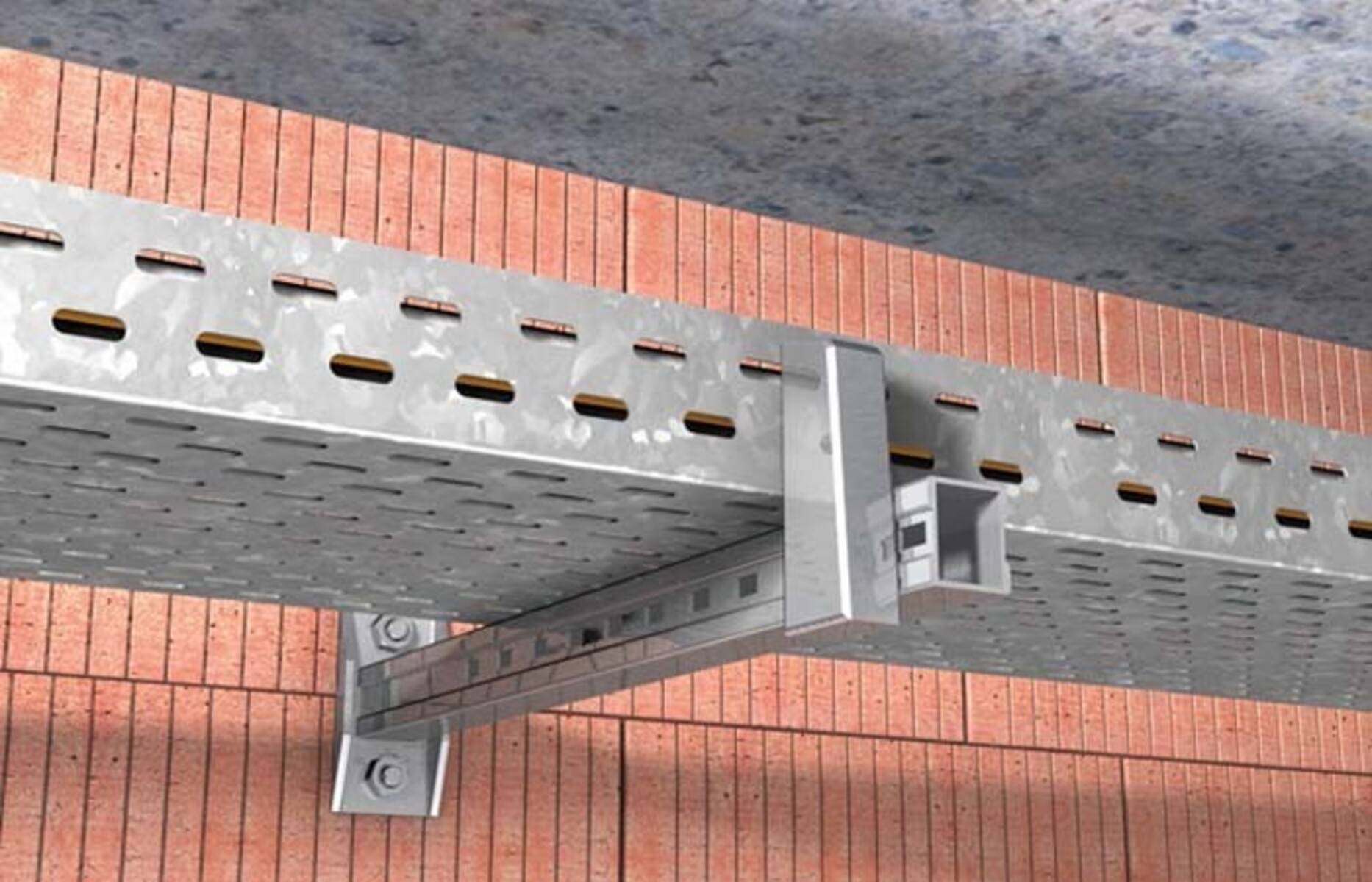 Eine Kabelrinne aus Aluminium, die auf einer Ziegelwand montiert ist und Elektrokabel in einem industriellen Umfeld trägt.