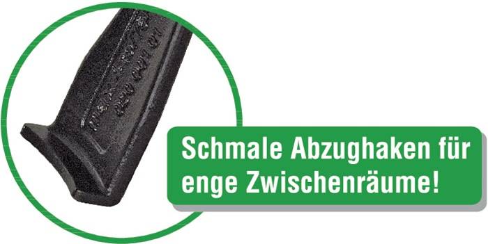 Eine Nahaufnahme einer schwarzen strukturierten Oberfläche mit deutschem Text, der „Schmale Abzuglinie, enge Zwischenräume