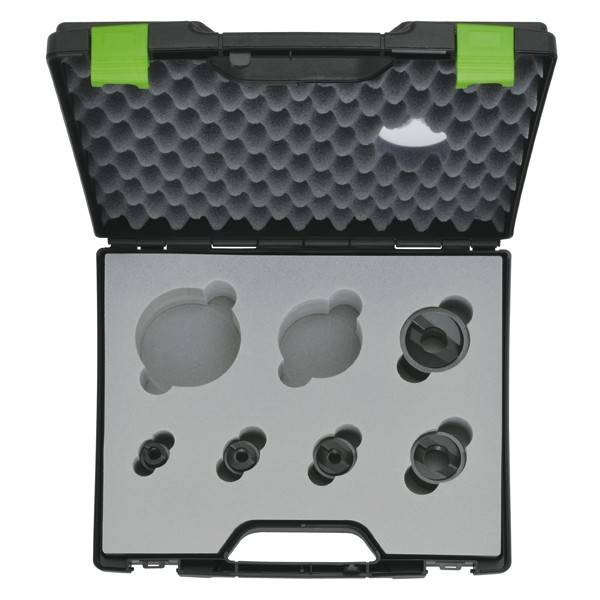 Eine schwarze Tasche mit grünen Clips und Schaumstoffauskleidung enthält verschiedene runde und sechseckige Einsätze, die für eine sichere und organisierte Aufbewahrung konzipiert sind.