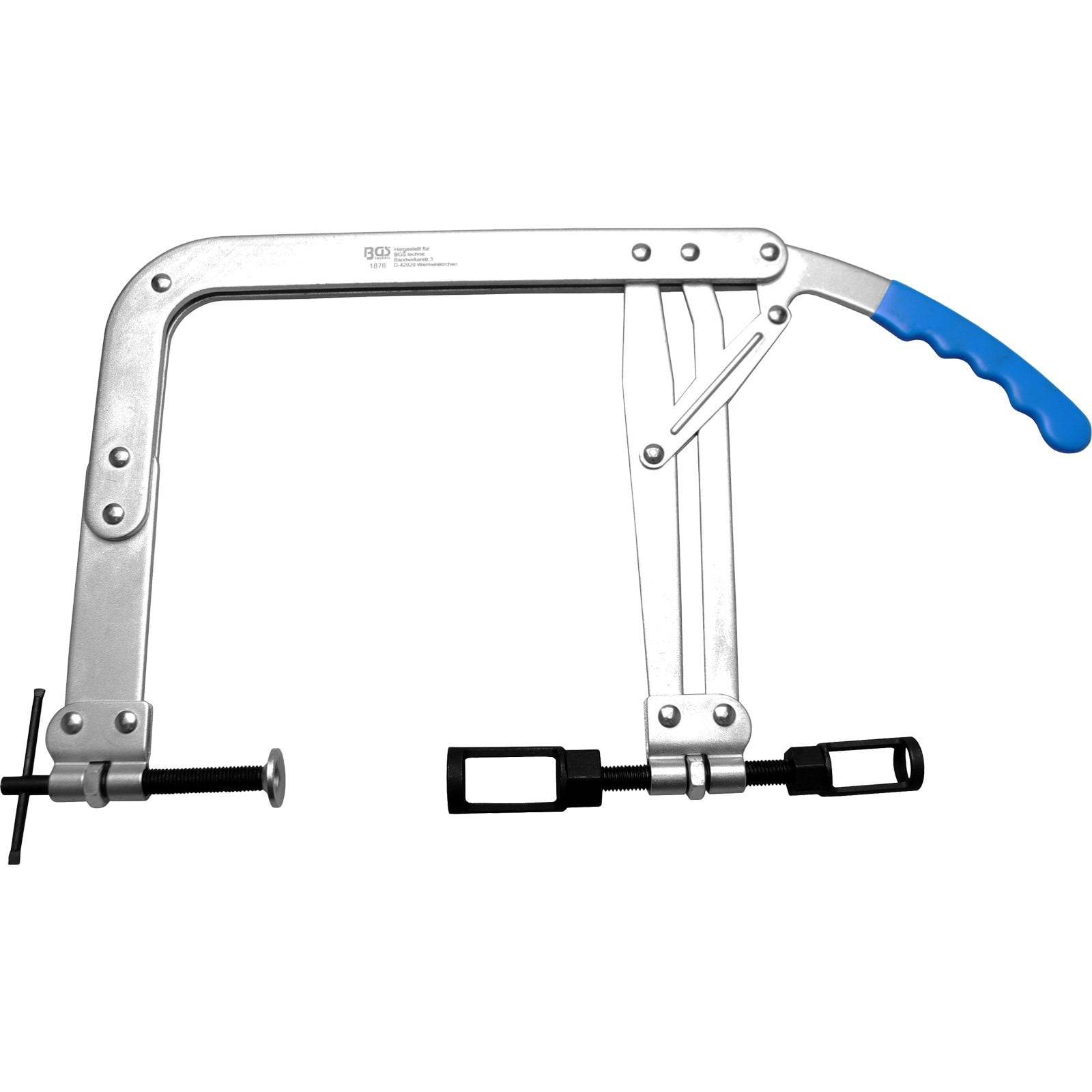 Ein silberfarbener Ventilfedern-Kompressor mit einem blauen Griff, der zum Komprimieren und Entfernen von Ventilfedern in Automotoren verwendet wird.