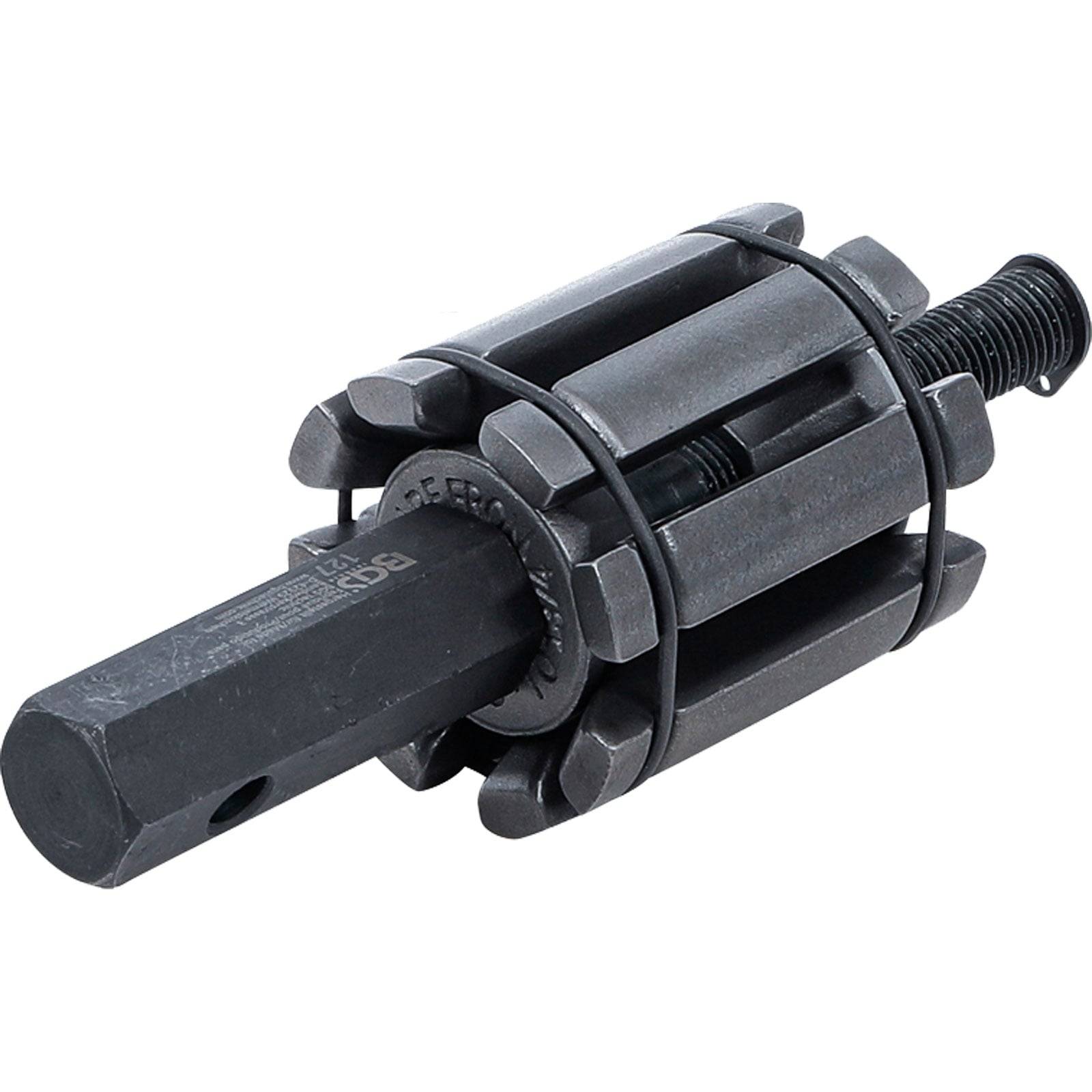 Ein schwarzes Zylinderhonwerkzeug mit verstellbaren Klingen und einer Welle, das zum Honieren oder Glätten von Motorzylinder verwendet wird.