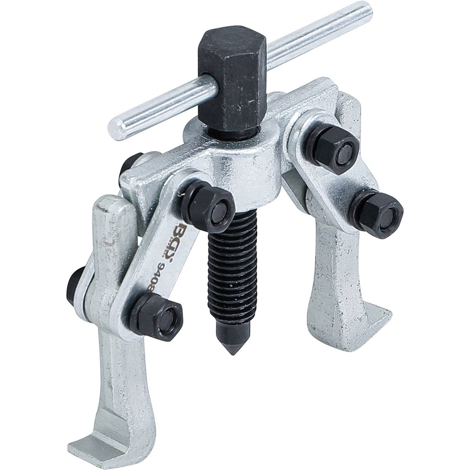 Ein metallischer Lagerabzieher mit zwei verstellbaren Armen und einem zentralen Schraubenmechanismus, der zum Entfernen von Lagern aus mechanischen Baugruppen verwendet wird.