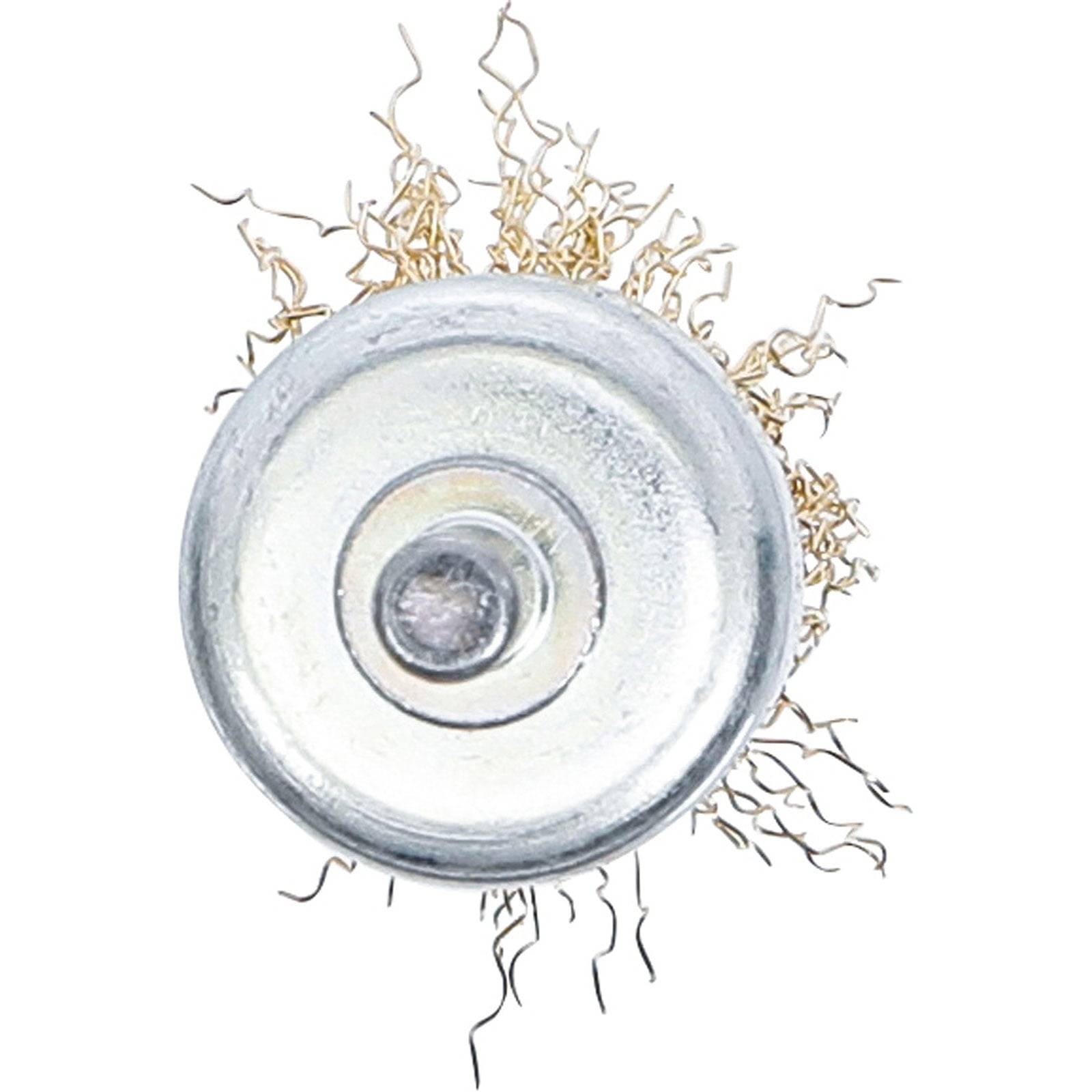 Draufsicht eines runden, metallischen Gegenstands mit dünnen, saitenartigen Drähten, die radial nach außen reichen und einer Samen mit Wurzeln ähneln.
