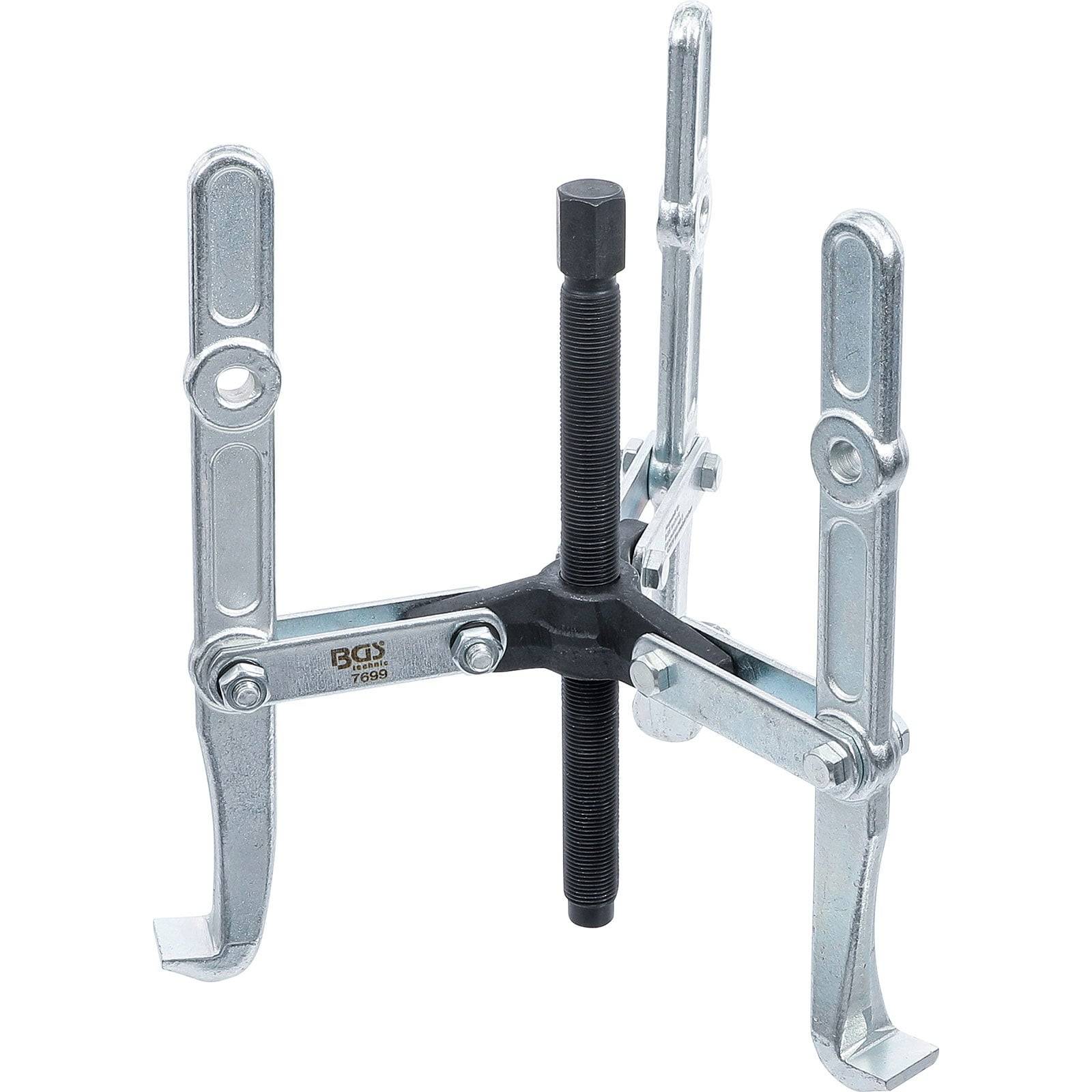 Ein Abzieher mit drei Backen, mit verstellbaren Armen und einer zentralen Gewindespindel, der zum Herausziehen von Komponenten in mechanischen Anwendungen verwendet wird.