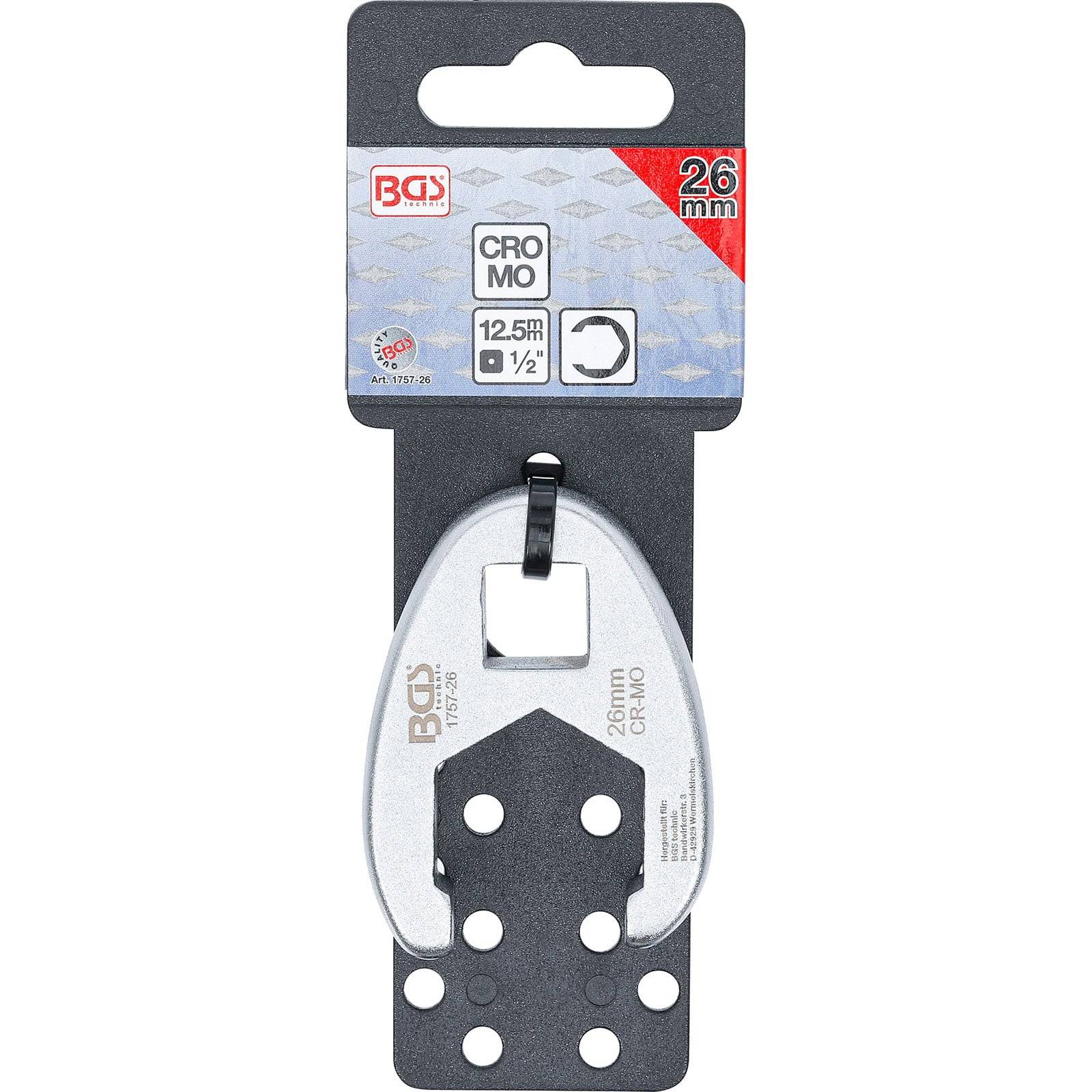 Ein silberner Schraubenschlüsselkopf ist an einer schwarz-grauen Verpackungskarte befestigt. Die Beschriftung lautet „BGS 26mm