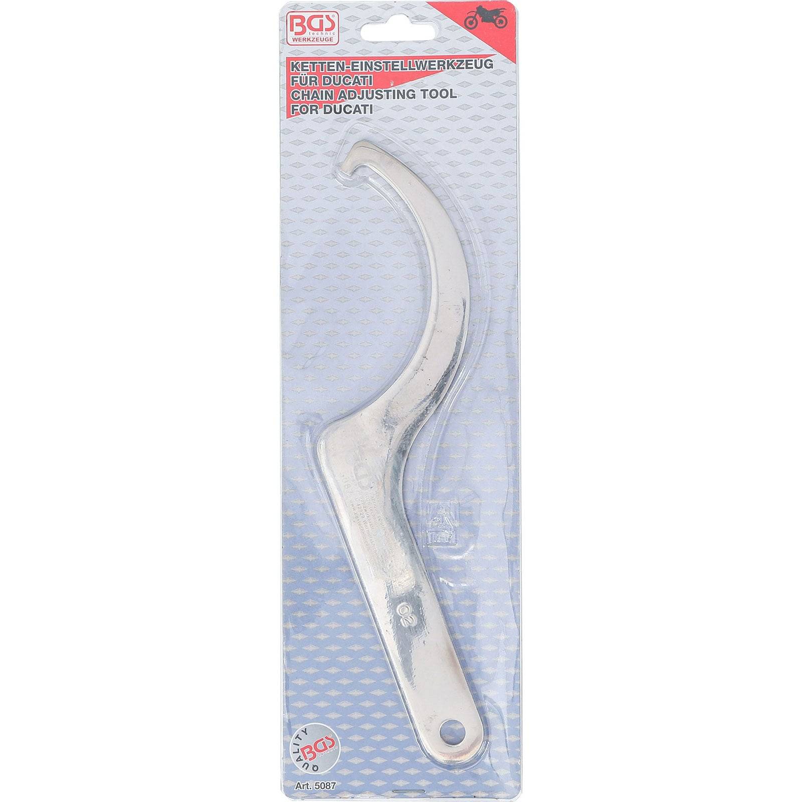 Ein Metall-Kettenjustierungswerkzeug in Kunststoffverpackung, beschriftet mit ‚Kettenjustierungswerkzeug für Ducati'. Es verfügt über eine gekrümmte Hakenkonstruktion.
