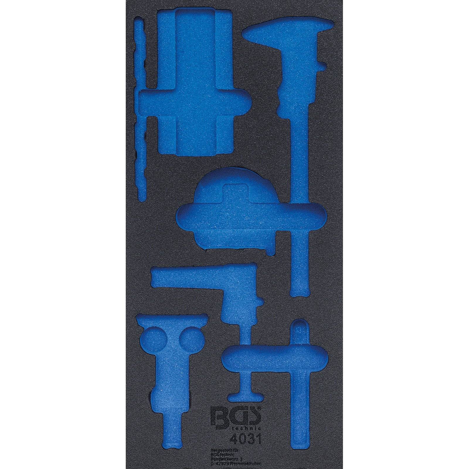Blaue Schaumstoffeinlage mit werkzeugförmigen Ausschnitten zur Organisation verschiedener Werkzeuge in einer Schublade oder Werkzeugkiste.