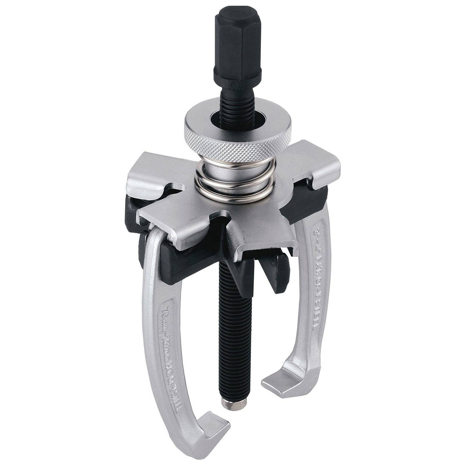 Ein Abziehwerkzeug mit drei Backen, mit silbernem Gehäuse und schwarzer Gewindestange, das zum Abziehen von Zahnrädern, Riemenscheiben oder Lagern von einer Welle verwendet wird.