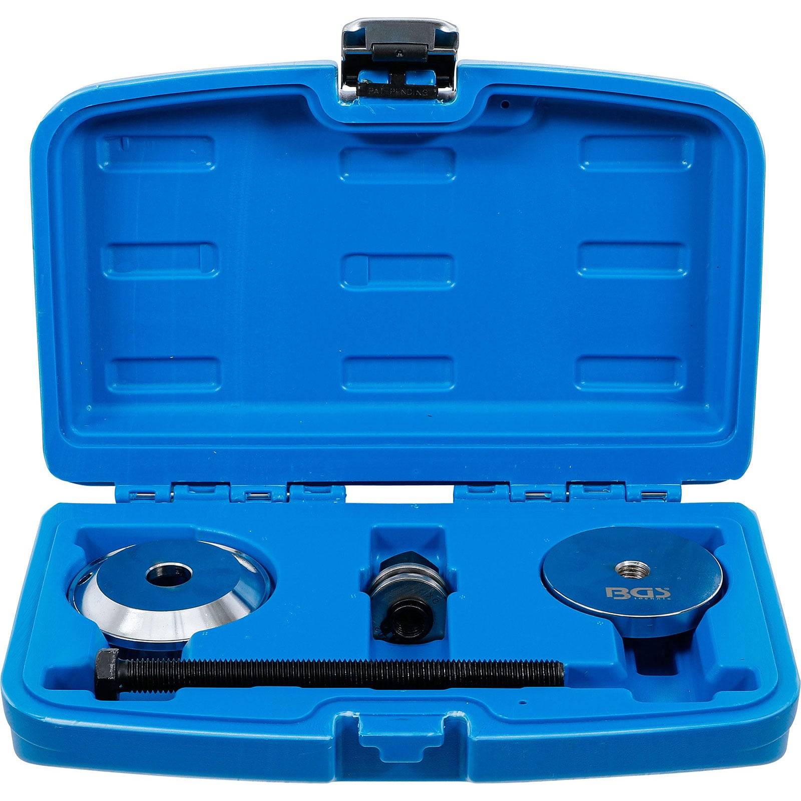 Ein blauer Plastikkoffer, der kreisförmige Metallwerkzeuge und eine gewindete Stange enthält, die zur Motorabstimmung und -ausrichtung verwendet werden. Das Innere ist geformt, um eine sichere Aufbewahrung zu gewährleisten.