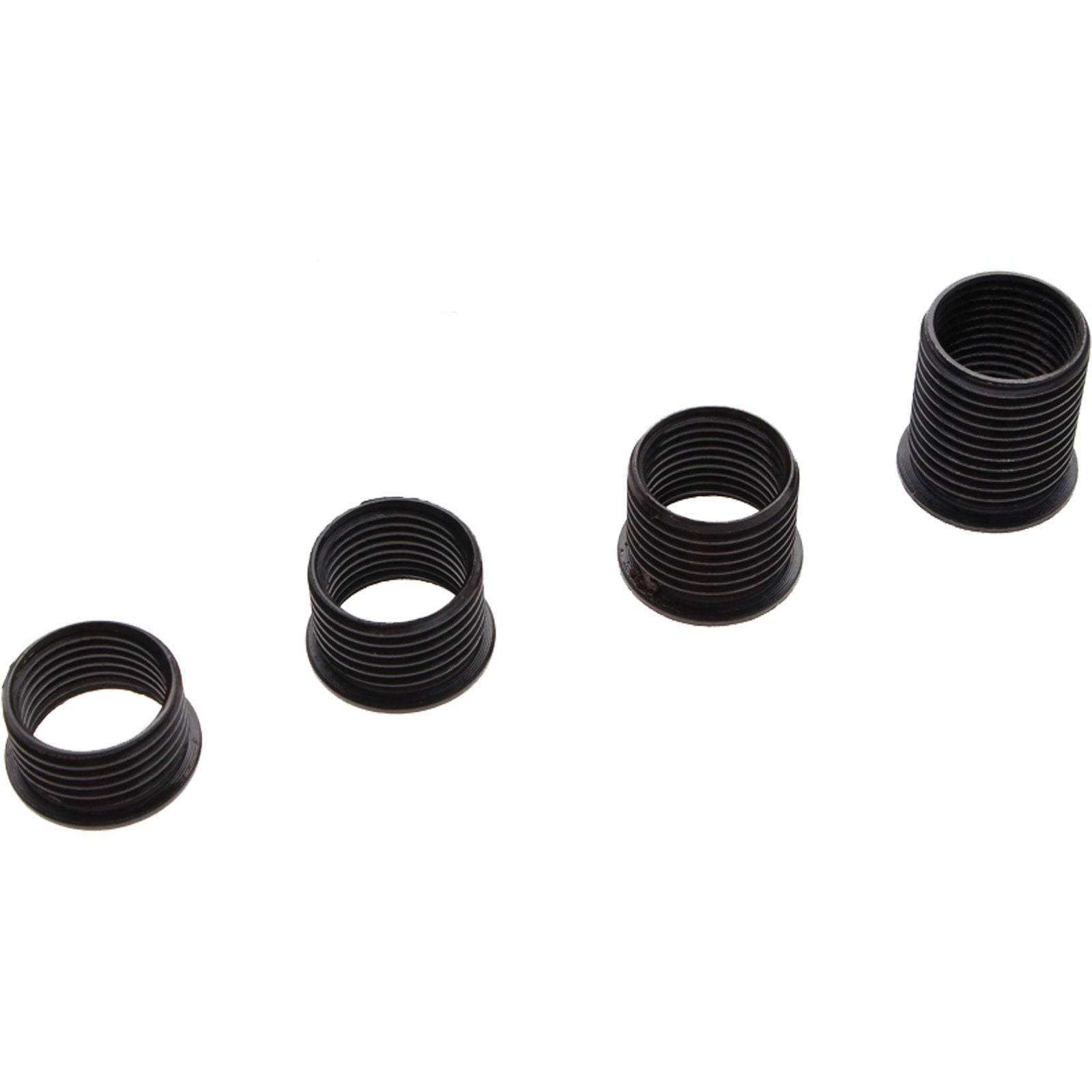 Vier schwarze Gewindespiralfedern unterschiedlicher Höhe, von links nach rechts in aufsteigender Reihenfolge angeordnet.