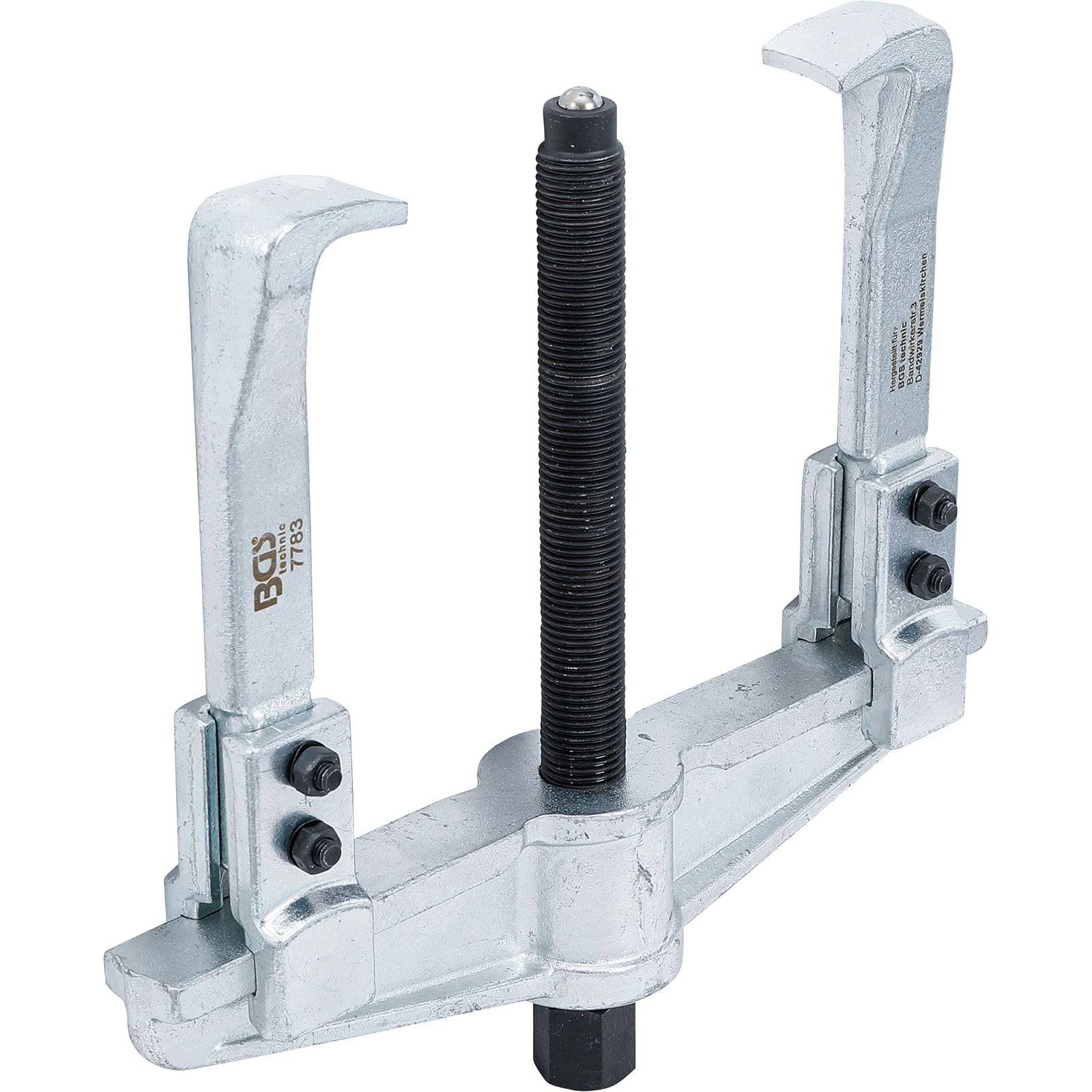 Ein Metallabzieher-Werkzeug mit zwei verstellbaren Armen und einer zentralen Schraube, das zum Herausziehen von Zahnrädern oder Lagern aus Maschinen verwendet wird.