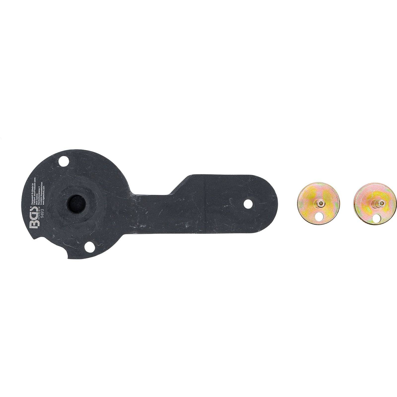 Ein schwarzes Metallwerkzeug mit kreisförmigem Ende und zwei mehrfarbigen Scheiben; möglicherweise zur Anpassung oder Befestigung runder Komponenten verwendet.