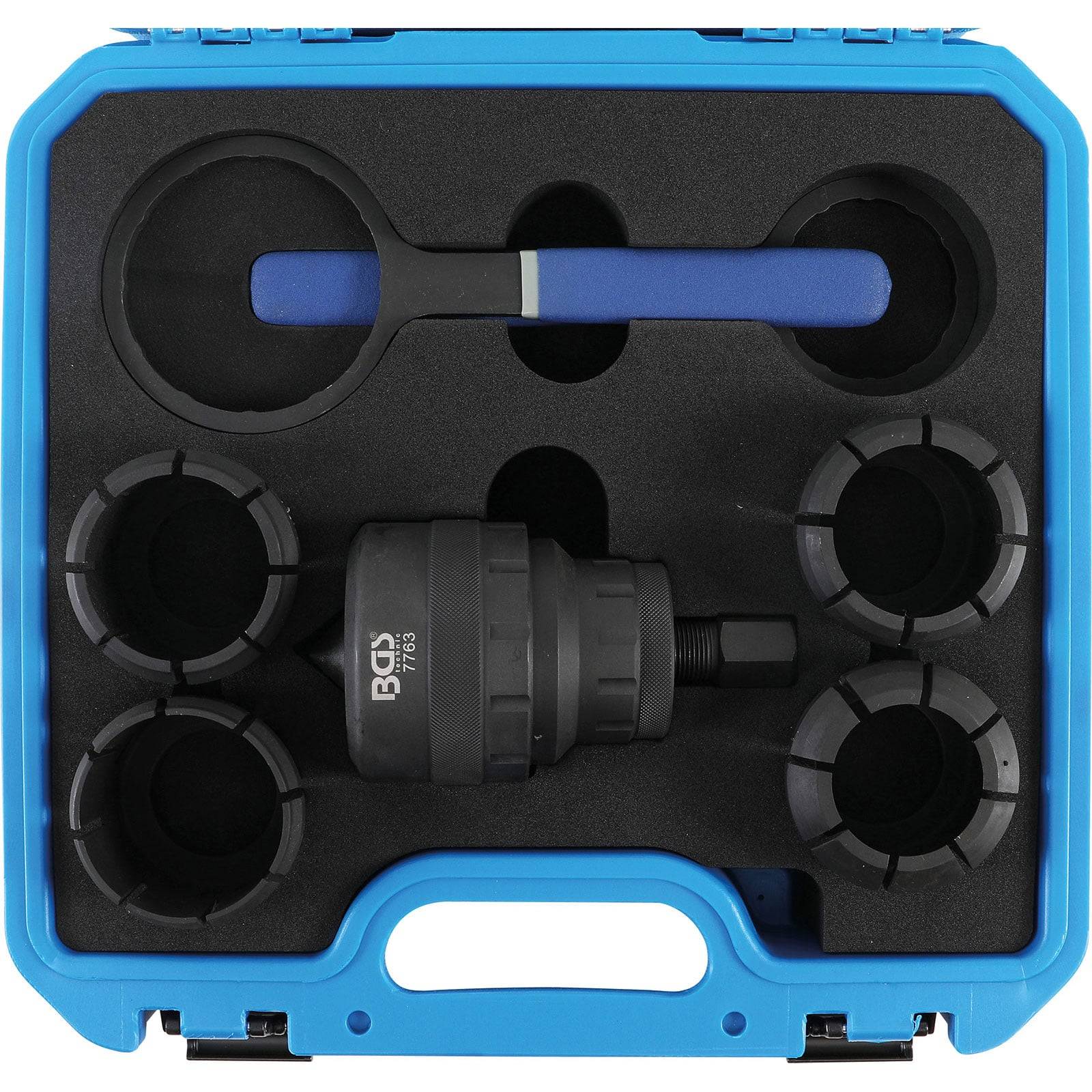 Ein blauer Kunststoffkoffer, der einen Abzieher-Werkzeugsatz mit mehreren Anbauteilen und einem Griff enthält, der für verschiedene mechanische Anwendungen verwendet wird.