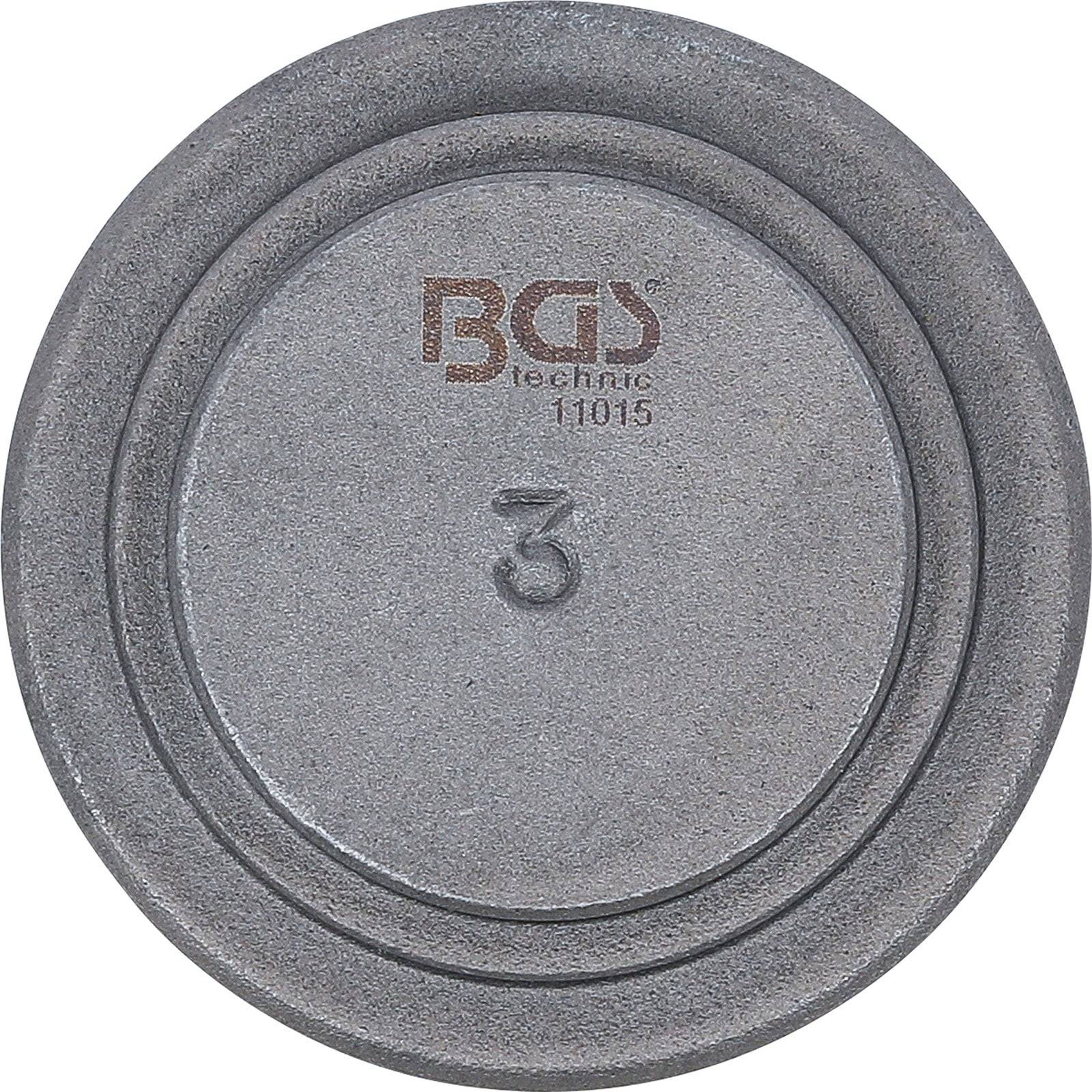 Runde, graue Metallwerkzeugkomponente mit der Zahl '3', die in der Mitte eingeprägt ist, und dem Text 'BGS technic 11015' darüber.