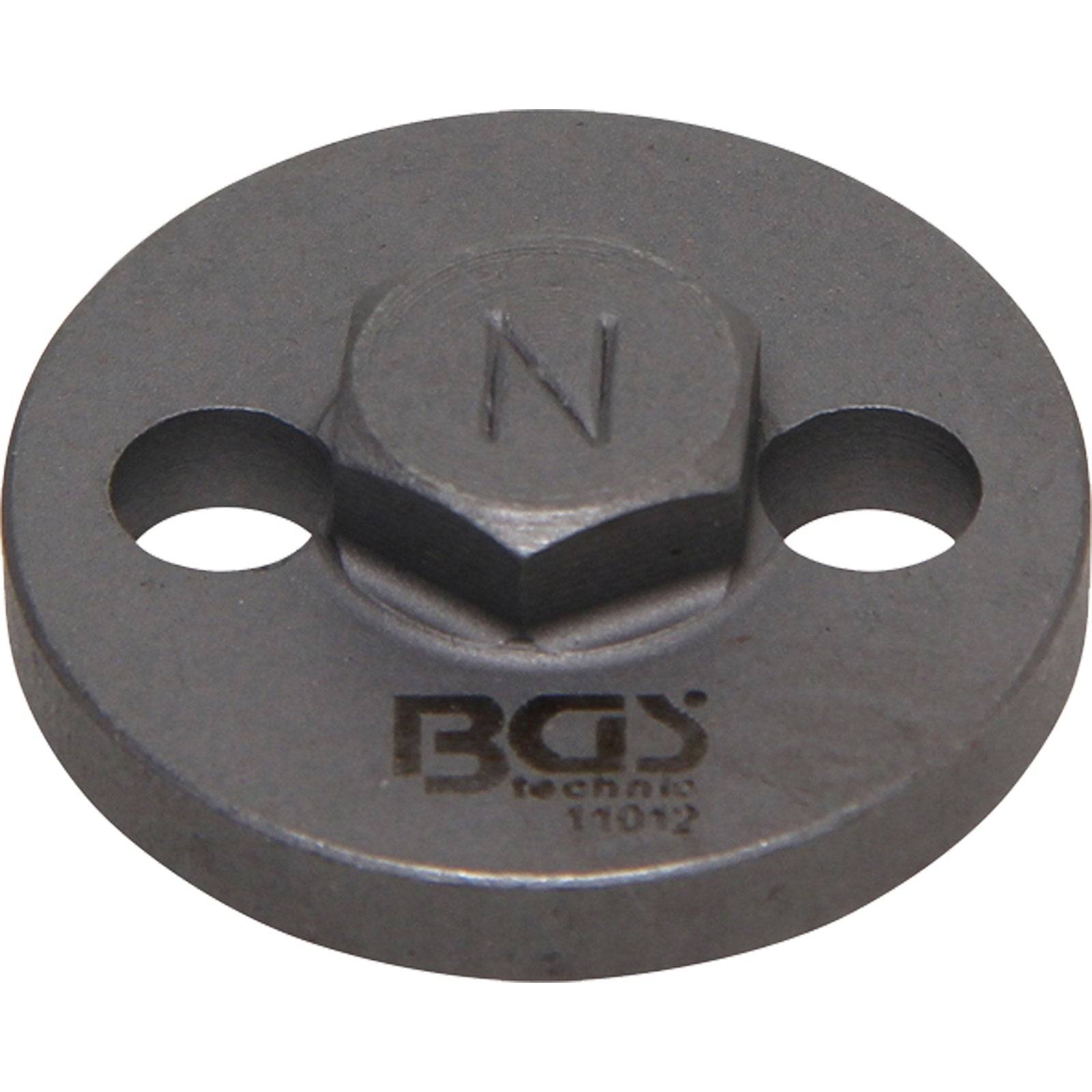 Ein Metallrundinstrument mit einem sechseckigen Teil in der Mitte, in den ein 'N' eingraviert ist, und zwei kreisförmigen Löchern. Es ist mit 'BGS technic 11012' beschriftet.