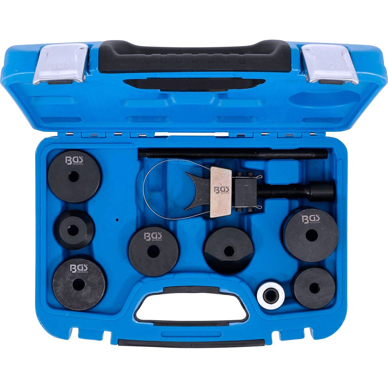 Eine blaue Plastikbox, die verschiedene schwarze kreisförmige Werkzeuge und ein Metallwerkzeug mit einem Griff enthält, in speziellen Fächern angeordnet.