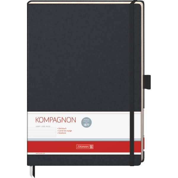 Schwarzes Notizbuch mit festem Einband, Gummiband und „KOMPAGNON"-Etikett auf dem Umschlag.