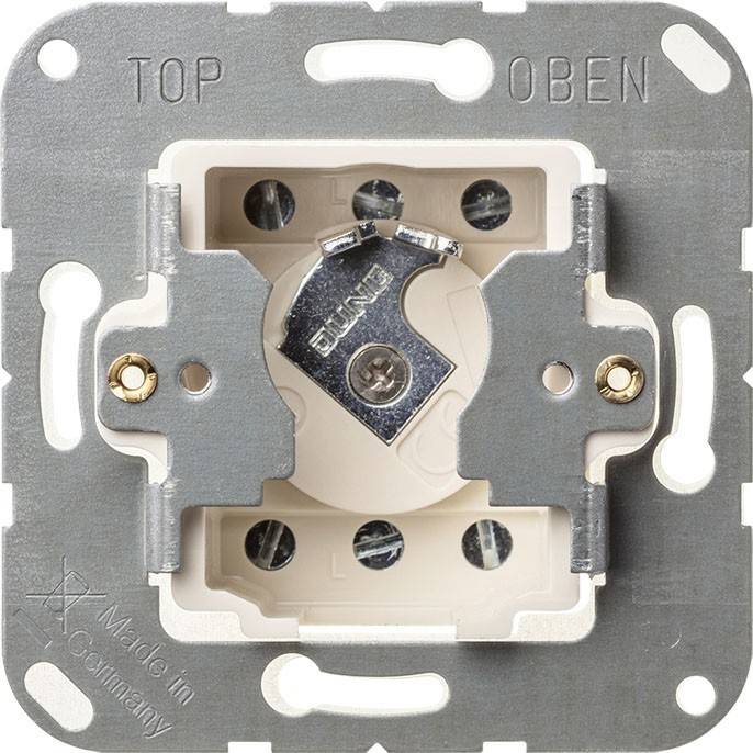 Eine Wandeinbau-Lichtschalterplatte mit Schraubklemmen, beschriftet mit 