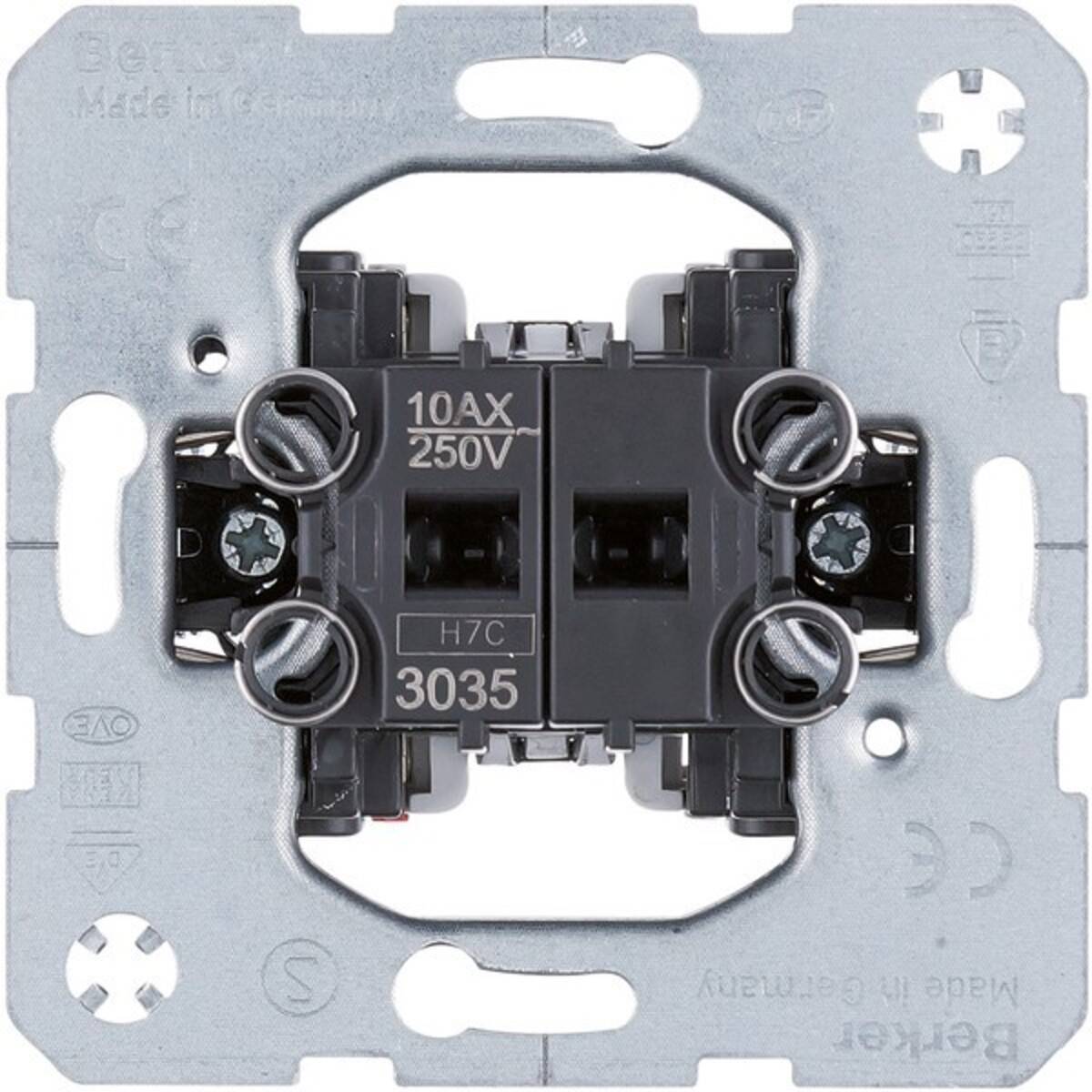Elektroschaltmechanismus '10AX 250V' mit metallischer Grundplatte und sichtbaren Schrauben, wahrscheinlich Teil einer Wandlichtschaltereinheit.