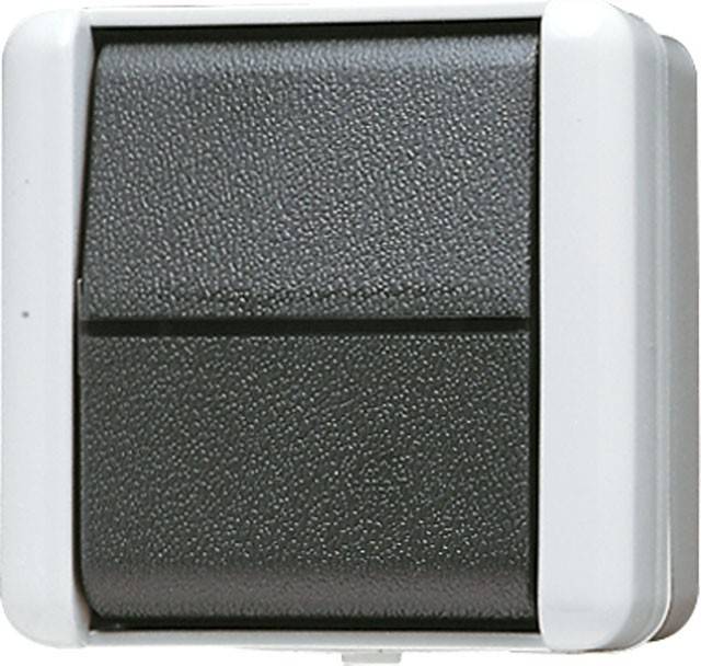 Ein schwarzer, rechteckiger Lichtschalter mit weißem Rahmen, an einer Wand montiert.