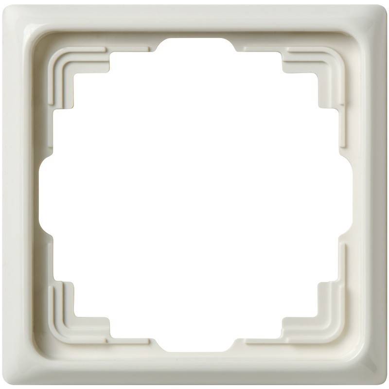 Ein weißer Kunststoff-Quadratschalter oder Steckdosenrahmen mit abgerundeten Ecken und einer zentralen Aussparung.