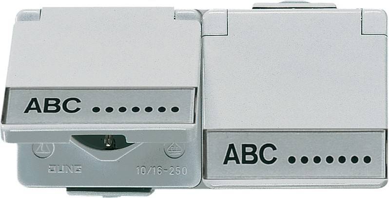 Nahaufnahme eines weißen Elektroschalters mit der Beschriftung 'ABC' und Anschlüssen für Kabel, die eine Komponente der elektrischen Installation in einem Haus oder Büro veranschaulicht.