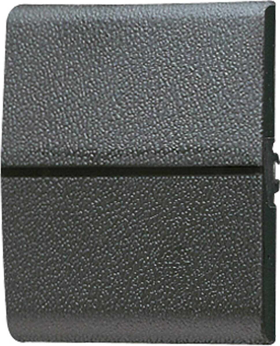 Eine Nahaufnahme einer strukturierten schwarzen Oberfläche mit einer vertikalen Naht, die einem Material ähnlich wie Leder oder Vinyl ähnelt.