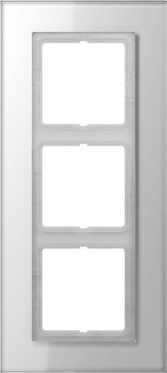 Ein weißes Elektroschaltertableau mit vier Steckplätzen und leeren Stellen für Schalter, vertikal an einer Wand montiert.