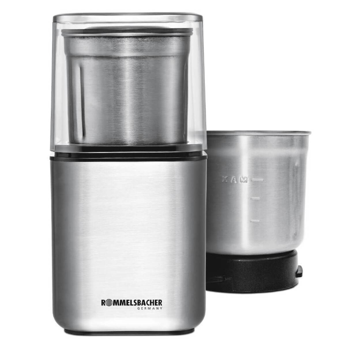 Elektrische Edelstahlkaffeemühle mit transparentem Deckel, gezeigt mit abnehmbarem Mahlbecher und zusätzlichem Becher auf weißem Hintergrund.