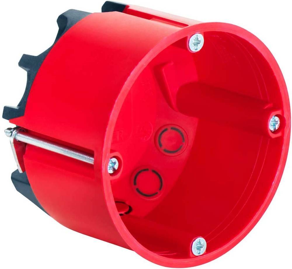 Rote kreisförmige elektrische Unterputzdose mit Schraublöchern und seitlichen Aussparungen, verwendet zur Installation von Steckdosen oder Schaltern in Wänden.