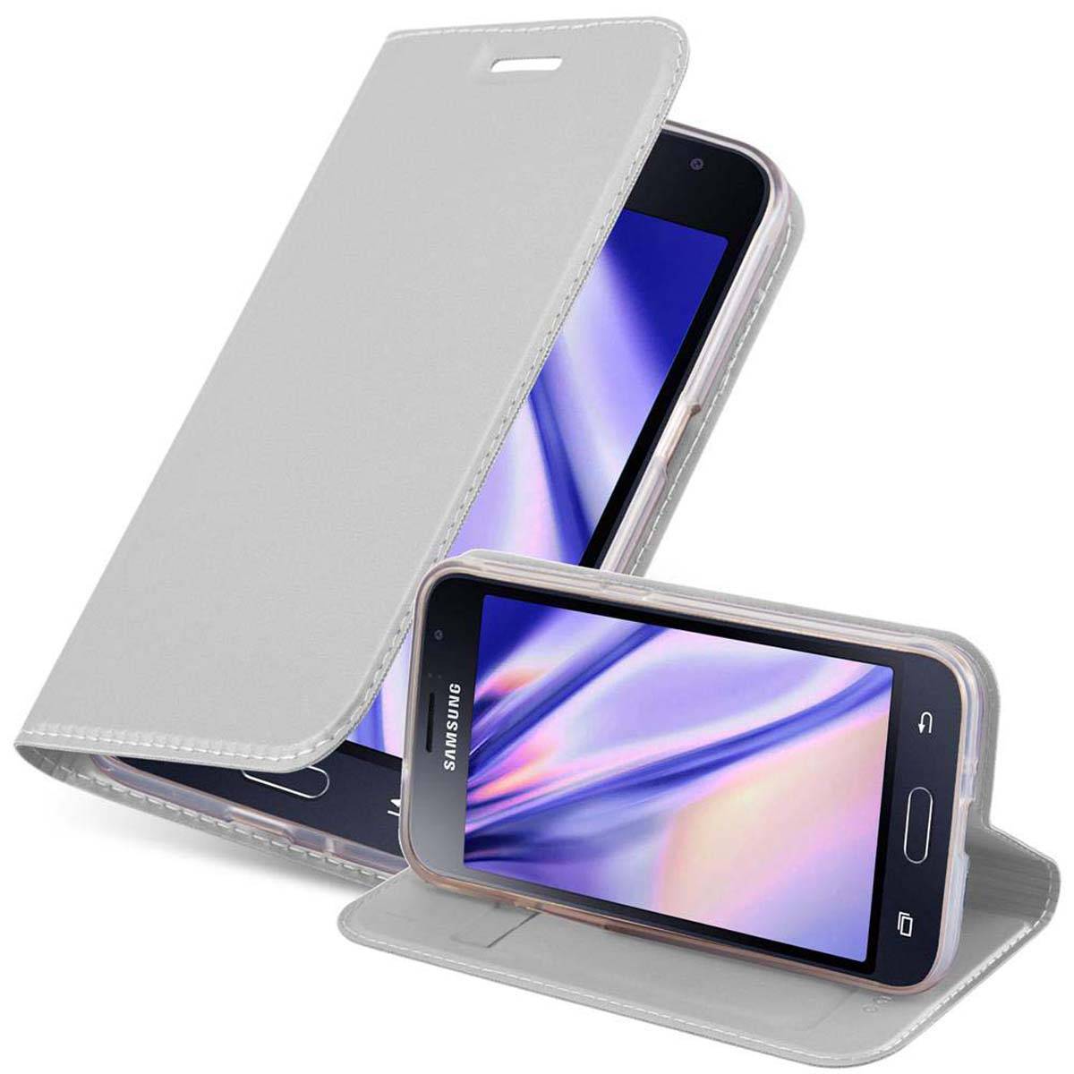 Cadorabo Handyhülle für Samsung Galaxy J1 2015 Schutz Hülle in Silber Cover Etui Book Case Booklet
