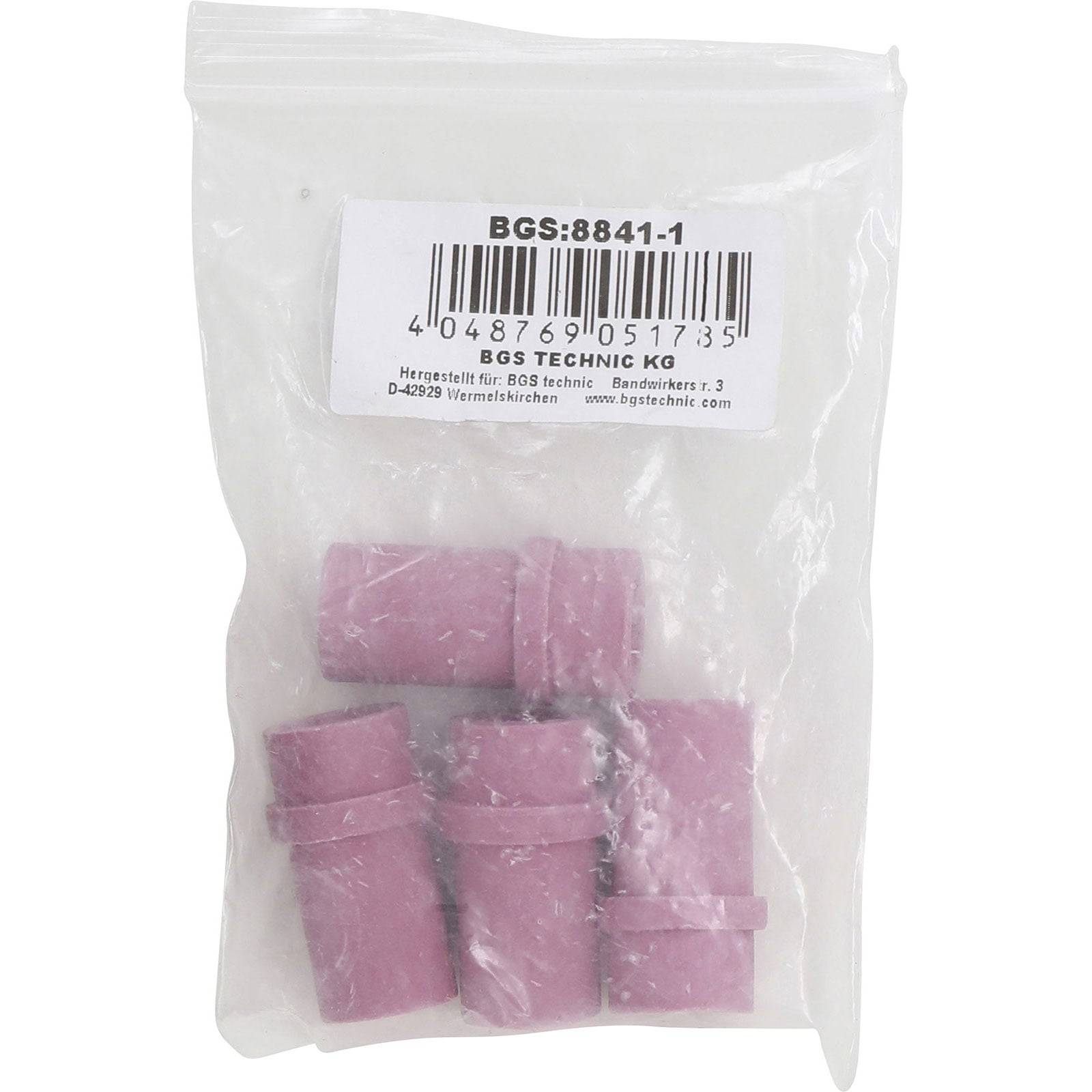 Eine Plastiktüte mit fünf rosa Zylindern, beschriftet mit 'BGS:8841-1'. Die Beschriftung zeigt Barcodes und Herstellerinformationen.