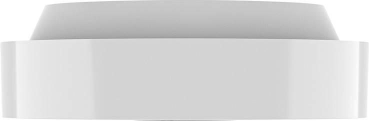 Ein weißer, leerer Raum mit glatten Wänden und einer geschwungenen Decke, die minimalistische Architektur andeutet.