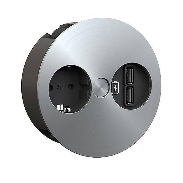 Eine runde metallische Steckdose mit zwei USB-Anschlüssen rechts und einer Standard-Steckdose links, entwickelt für moderne Ladeanforderungen.