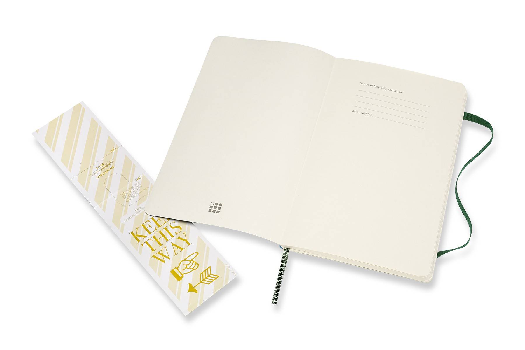 Offenes cremefarbenes Notizbuch mit liniertem Titelblatt und Seidenbandlesezeichen, gezeigt neben einer gemusterten Geschenkbox mit der Aufschrift 