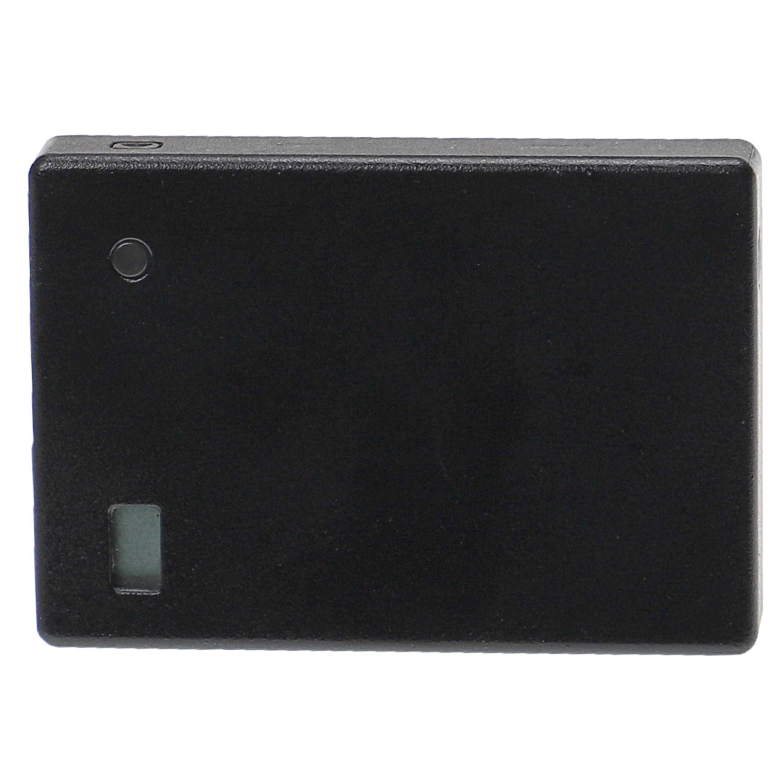 Ein kleines, rechteckiges schwarzes Gerät mit einem Knopf und einer quadratischen Buchse auf einer Seite, möglicherweise ein elektronisches Gerät wie eine Fernbedienung oder ein Sensor.