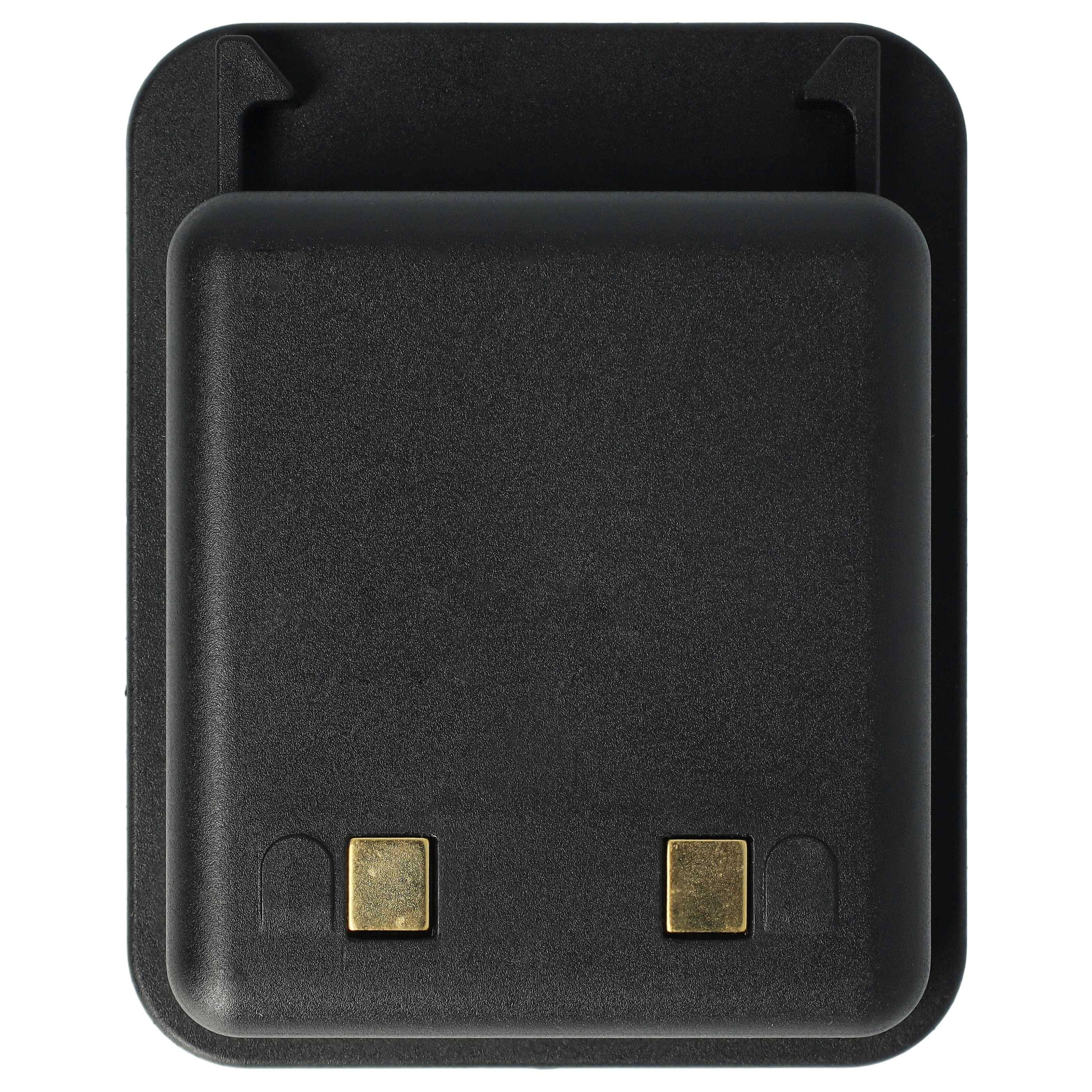Schwarzer rechteckiger Stromadapter oder Ladegerät mit zwei goldenen Kontaktstiften auf der Vorderseite, dargestellt auf weißem Hintergrund.