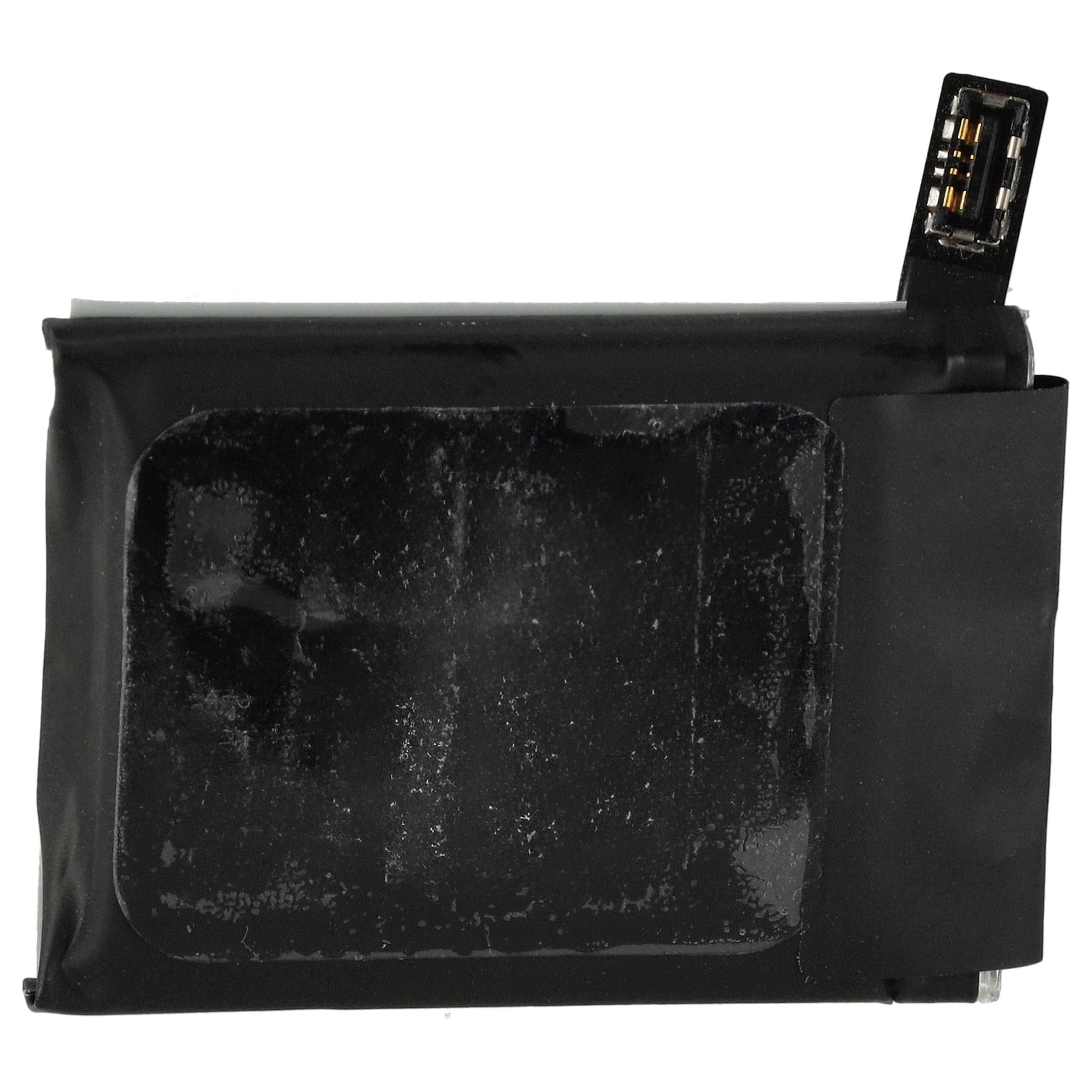 Eine schwarze rechteckige Lithium-Ionen-Batterie mit einer Anschlusslasche in der oberen rechten Ecke, die sichtbare Verschleißspuren auf ihrer Oberfläche aufweist.