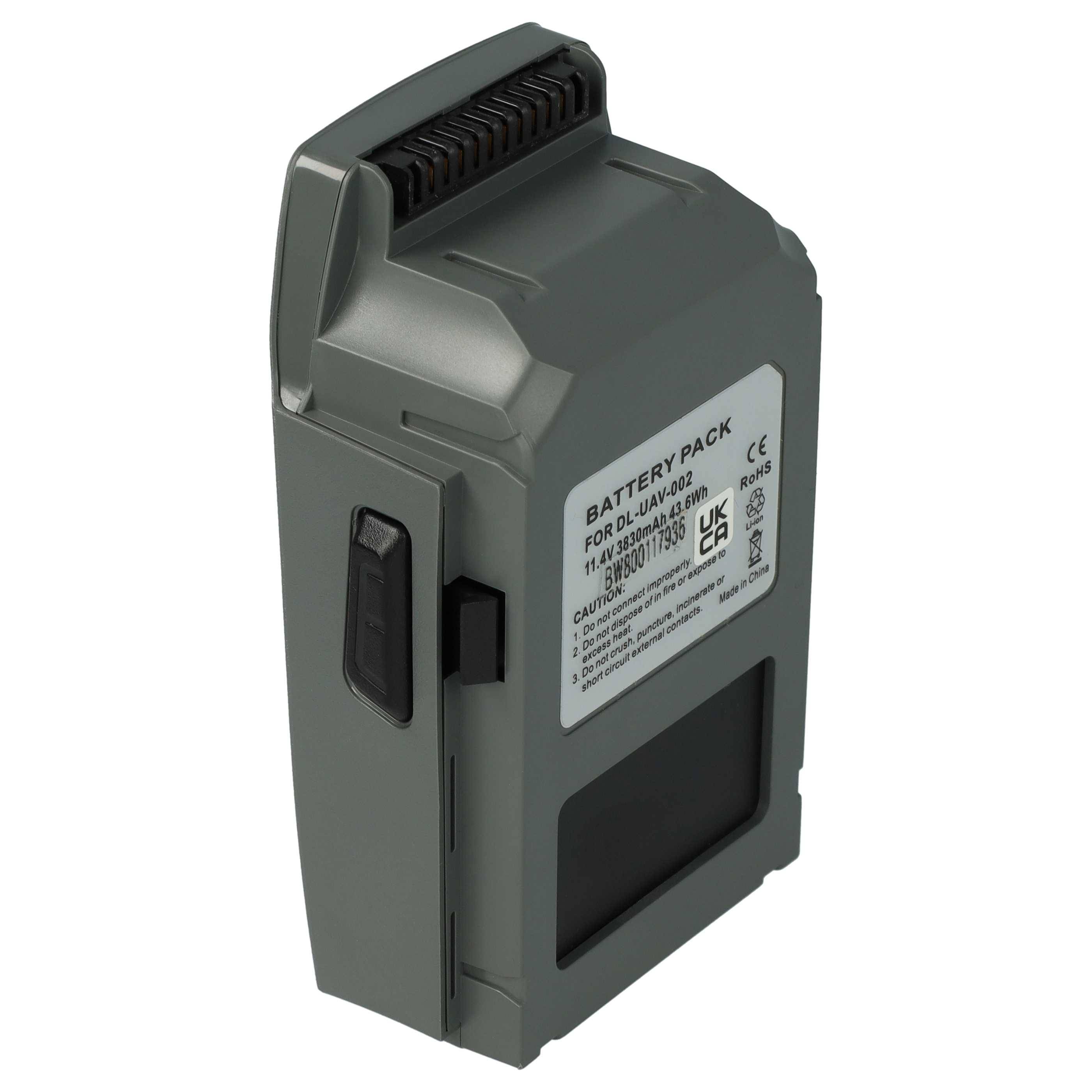 Ein grauer wiederaufladbarer Batteriepack mit einem Stecker oben und einem Etikett mit technischen Spezifikationen auf der Seite.