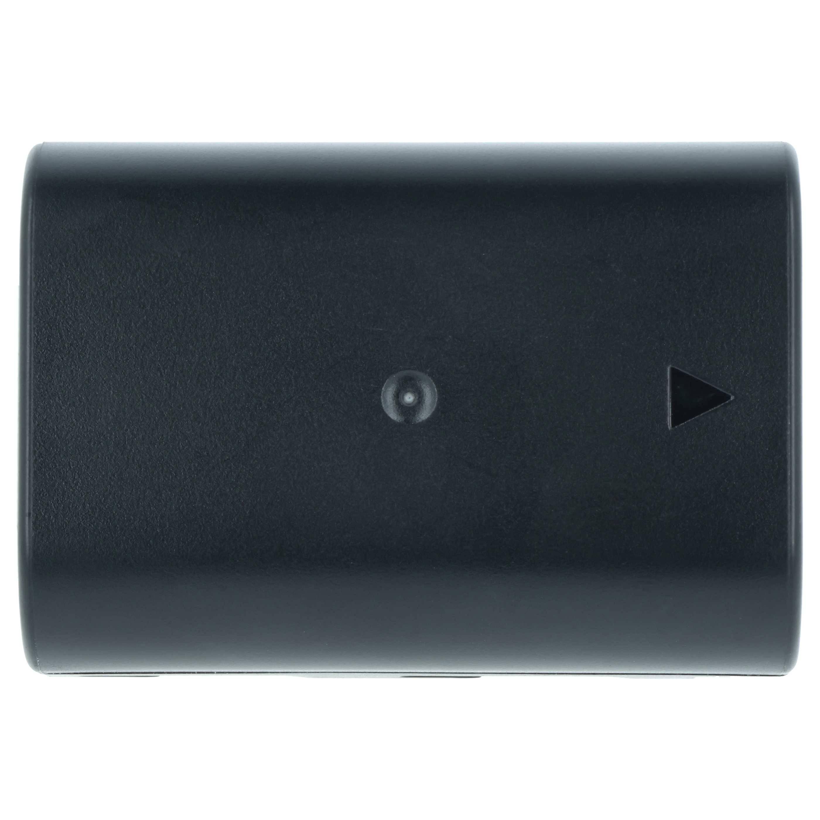 Eine schwarze rechteckige Batterie mit einer kleinen kreisförmigen und dreieckigen Markierung auf ihrer Oberfläche, von oben betrachtet.