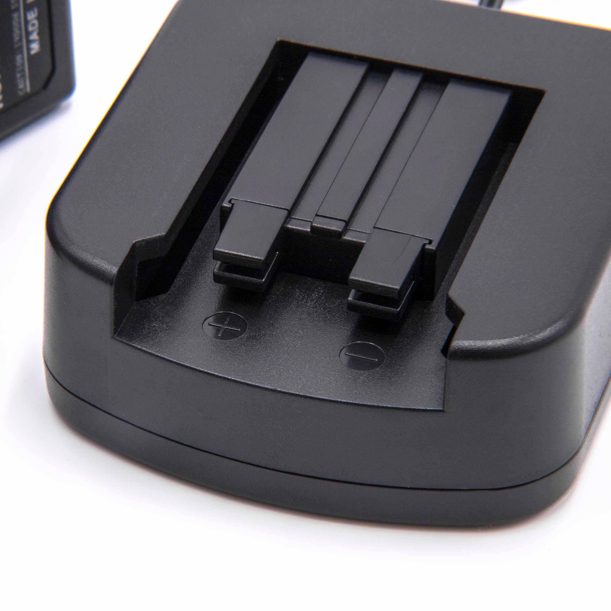 Ein schwarzes Batterieladegerät mit zwei Metallkontakten zum Aufladen, gezeigt auf weißem Hintergrund, mit einem teilweise sichtbaren Stromstecker auf der linken Seite.