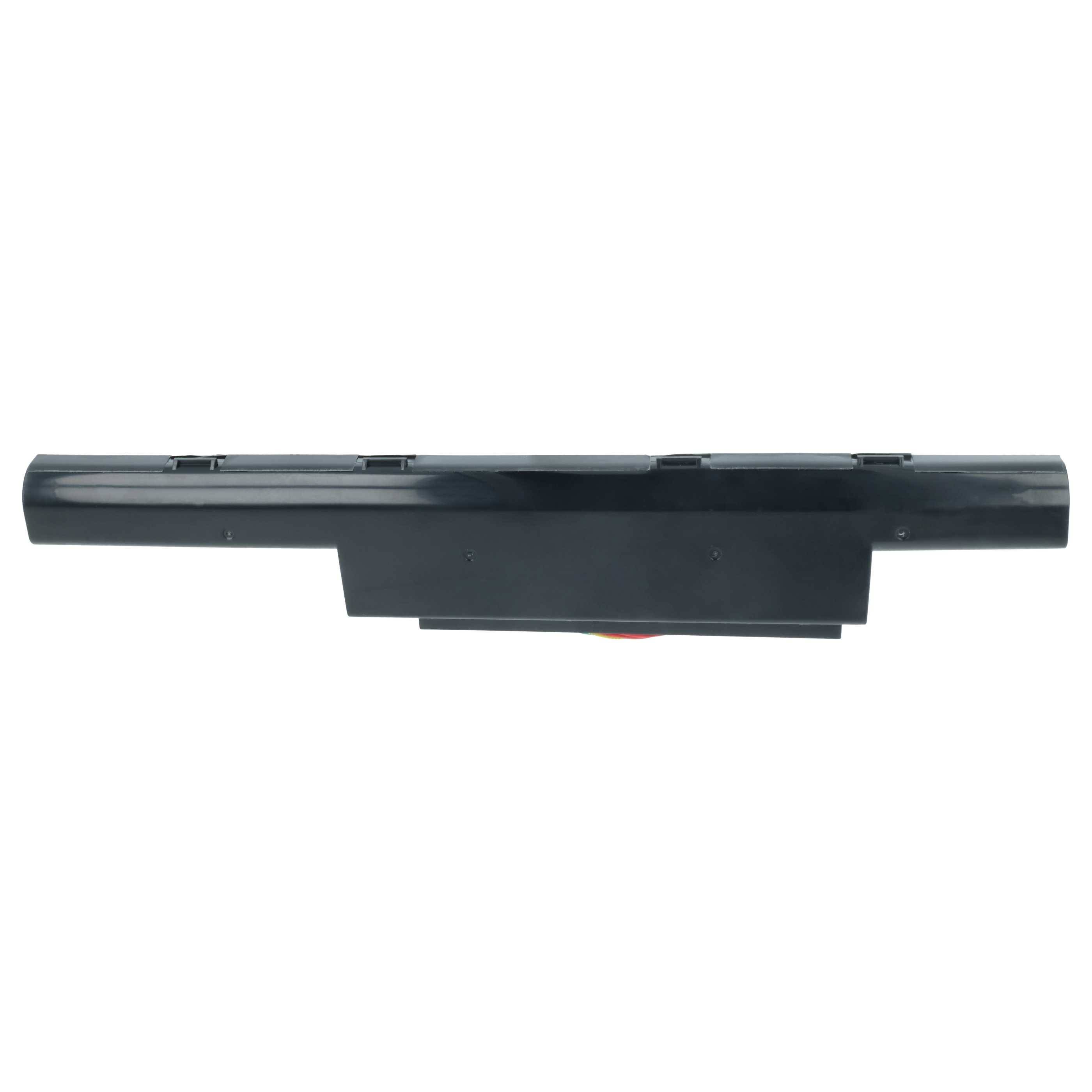 Eine schwarze Laptop-Batterie von der Seite betrachtet, die die längliche rechteckige Form und die Anschlussklemmen zeigt.