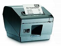Ein kleiner Bondruckdrucker mit einem Papierstreifen mit dem Titel „Unsere Bedarfsliste