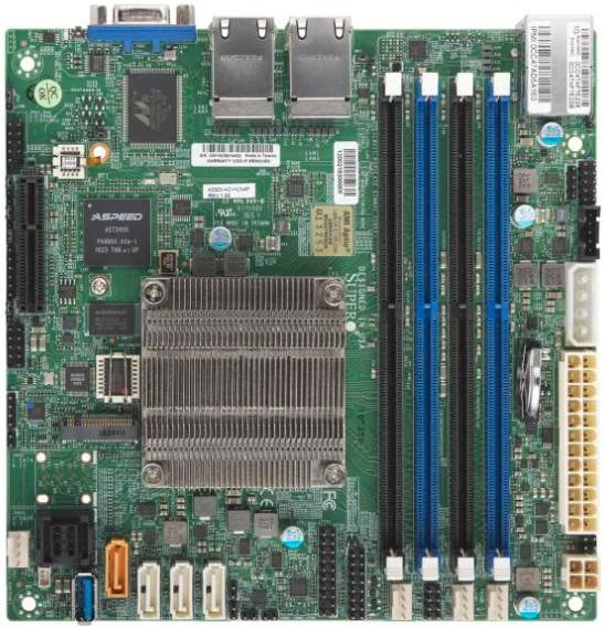 Computermainboard mit großem Kühlkörper, zwei CPU-Sockeln, vier RAM-Steckplätzen, Erweiterungssteckplätzen und sichtbaren hinteren Ein-/Ausgabeanschlüssen.