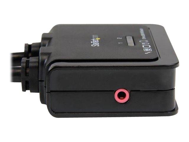 Schwarzer elektronischer Adapter oder Audio-Interface-Box mit Kabeln, die auf der linken Seite angebracht sind, und einer rosa 3,5-mm-Klinkenbuchse auf der Vorderseite.